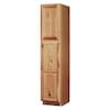 a tall wooden cabinet sitting on top of a white wall