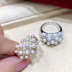 Highline: Famous Style Product Information OriginJapan MaterialAkoya Pearl, 18k Gold, and Natural Diamonds DimensionsRing Weight 7.2g Pearl Shaped: Round Size: 3-4 mm Quality: AA+ Nacre: Very Thick Color: White Luster: Very High Accessories Metal: 18k White Gold Other: 0.62ct of SI Quality Natural Diamonds Royal Ring, Akoya Pearl Ring, Royal Rings, Pearl Chandelier Earrings, Akoya Pearl Earrings, Golden South Sea Pearls, Akoya Pearls, Sea Pearls, Bling Rings