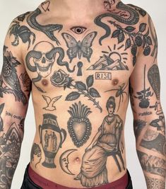 a man with lots of tattoos on his chest