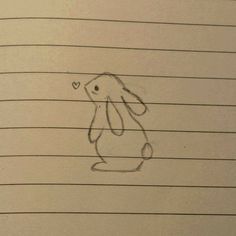 a drawing of a bunny on lined paper