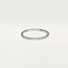 a white gold wedding band with round diamonds