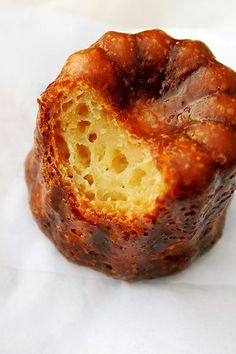 a piece of bread sitting on top of white paper