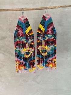 colorful beaded earrings hanging from a clothes line