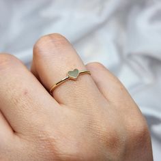 14K Solid Gold Dainty Heart Promise Ring for Her 🌟 Product Features: ⚖️ Weight: 1.05 Grams 🌈 Material Colors: Available in Yellow Gold, Rose Gold, and White Gold 🎁 Presentation: Shipped with a special box and bag, perfect for gifting 🔄 Returns: Right to return within 7 days ✨ Material and Color: Designed to never fade or darken 🛠️ Handcraftsmanship and Uniqueness: Handcrafted with love, may vary by 5% (+-) Give a heartfelt token of love with the 14K Solid Gold Dainty Heart Promise Ring. Thi Dainty Gold Heart Ring For Promise, Dainty Heart Ring With Simple Design For Promise, Dainty Simple Design Heart Promise Ring, Dainty Heart Midi Promise Rings, Dainty Heart Cut Birthstone Ring, Delicate Heart-shaped Midi Promise Ring, Delicate Heart Shaped Midi Promise Ring, Minimalist Rings With Heart Charm For Everyday, Dainty Stackable Gift Rings With Heart Charm