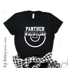 a t - shirt that says panther wrestling on the front with a checkered bow around it