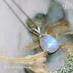 A moonstone silver pendant is a delicate piece of jewelry that combines the ethereal beauty of moonstone with the timeless elegance of sterling silver. The moonstone, known for its pearly sheen and mesmerizing inner glow, is often described as having a moonlit quality. This soft luminescence is caused by a phenomenon called adularescence, which creates a play of light within the gemstone. The silver setting complements the moonstone's subtle brilliance. It can be a simple and modern bezel setting that allows the moonstone to take center stage, or a more intricate design with swirling vines or crescent moon motifs that echo the stone's celestial connection. Moonstone pendants come in a variety of shapes and sizes. Round and oval cuts are classic choices, while pear or teardrop shapes add a Delicate Moonstone Pendant Jewelry, Silver Moonstone Ring With Moon Charm As Gift, Elegant Moonstone Necklace With Moon Charm, Silver Jewelry With Moon Charm For Formal Occasions, Elegant Moonstone Pendant Jewelry, White Gold Moonstone Round Pendant Jewelry, Formal Silver Jewelry With Moon Charm, Formal Moon Phase Sterling Silver Jewelry, Elegant Teardrop Moonstone Ring