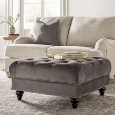 a living room scene with focus on the ottoman