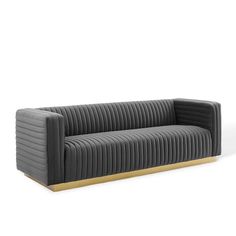 a grey couch with wooden legs and an upholstered back, on a white background