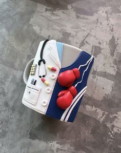 a cake made to look like a pair of boxing gloves on top of a bag