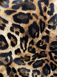 an animal print pattern that looks like it has been dyed brown and black with gold highlights