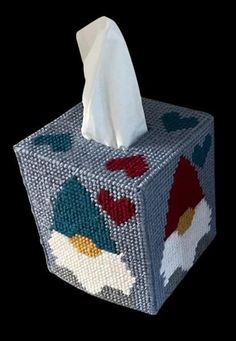 a close up of a tissue box on a black background