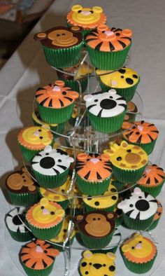 cupcakes are arranged in the shape of a tree