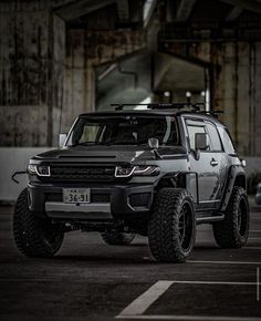 a black and silver truck parked in a parking lot