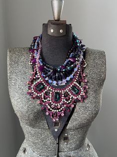 Glitz and glam galore in this piece!  I am so excited to be listing this amazing piece as it is really one of the most stunning pieces I have recently designed.  On. The bottom is a fantastic vintage Czech rhinestone bib necklace repurposed into this amazing ensemble that you see.  Above is strung chunky amethyst sticks, light pink moonstone with rhinestone spacers into between, an dyed purple jade briolettes.  Repurposed vintage lucite in black and vintage pink swarovski crystals also make up p Party Crystal Necklaces With Gemstone Accents, Bohemian Crystal Necklaces With Jewels For Party, Bohemian Crystal Necklaces For Party, Bohemian Crystal Necklace With Jewels For Party, Purple Jeweled Necklaces For Party, Opulent Jeweled Necklaces For Party, Purple Party Jewelry With Stones, Purple Jeweled Necklace For Party, Unique Crystal Jewelry With Rhinestones