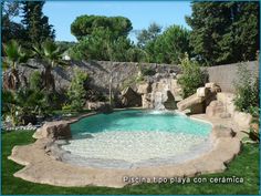 the pool is surrounded by rocks and water