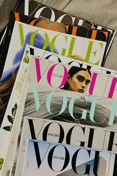 several magazines stacked on top of each other