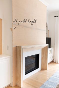 an unfinished fireplace in the middle of a living room