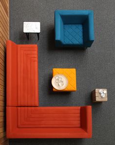 an overhead view of a living room with orange and blue furniture, including a couch