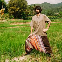 "Harem Pants for Men, Festival Harem Pants, Hemp Pants, Hemp Clothing 100% high-quality soft vintage hand-loomed hemp fabric in solid black. Very rare find material from our own collection of more than 15 years. These is very special harem pants fully made with the original vintage Hmong hand-loomed hemp. The fabric is thick though soft and breathable. You can enjoy the pants in hot or chilly weather. That is the special quality of hemp fabric. Side tie with a thick waistband and long ties that Mens Hippie Fashion, Hemp Pants, Indian Pants, Vintage Harem Pants, Harem Pants Men, Hemp Clothing, Harem Pants Women, Hemp Fabric, Men Pants