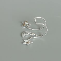 Sterling silver ear cuff and wrap earring.Comes with a crescent moon and stars. This listing is for ONE PAIR Size: 15 x 19 mm Stars: 5x 5mm Crescent moon: 6 x 5mm Weight: 0.90gm These earrings are made of real 925 hypoallergenic sterling silver. All my pieces are sent in a gift box. I can include a personal message from you if needed You are welcome to contact me at... bhavnakwintra1956@gmail.com For more beautiful pieces from my shop, please browse 👇 TOE RINGS: https://www.etsy.com/your/shops/ Adjustable Silver Trendy Ear Cuff, Adjustable Silver Ear Cuff Trendy Style, Silver Star-shaped Pierced Cartilage Earrings, Silver Star-shaped Cartilage Earrings With Pierced Design, Celestial Silver Cartilage Earrings, Silver Star-shaped Ear Cuff As Gift, Silver Star Shaped Ear Cuff As Gift, Silver Star-shaped Ear Cuff For Gift, Silver Star Shaped Ear Cuff Gift