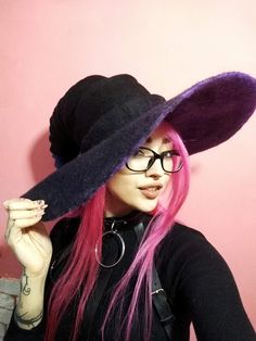 * An unusual felt helmet for a witch, a wizard or another creature of black color with a purple tip, as well as purple inside, will become an indispensable accessory, perfectly complement your image and reveal to you a certain magic secret. This hat will also be an excellent gift for relatives and friends, you will not only please them, but also pleasantly surprise you with such an unusual gift, because you give them not just a hat, you give emotions. Magic hat is well suited for a themed party Hat Cosplay, Purple Tips, Felted Hat, Wizard Hat, Magic Hat, Witch Halloween Costume, Wet Felt, Unusual Gift, Witch Costume