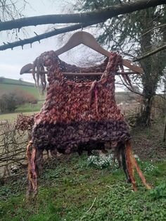 A Hand Knitted Forest Fairy Top/Cropped Jumper I've hand knitted this jumper from hand dyed and handspun wools and art yarns. It looks lovely to wear in layers, and has a beautiful indian bells and recycled sari silks.  On the hanger unstretched, this one measures 32 inches (81cms) around and 13 inches (33cms) from the top of the shoulder to the bottom hem, so is about a UK size 8 - 10 Washing instructions - Handwash separately very gently in cold water, with a natural eco friendly washing liqui Fairycore Sweater, Knitted Cropped Sweater, Cropped Sweater Vest, Hand Dyed Clothing, Dread Accessories, Double Ended Dreads, Fairy Top, Festival Clothes, Crochet Jumper