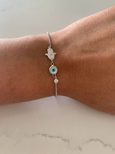 Evil Eye Hamsa Bracelet in Sterling Silver, Evil Eye, Hamsa, Bracelet, Guardian Angel Bracelet, Sterling Silver Bracelet, Hamsa Bracelet ----------------------------------------------- ♦ ------------------------------------------------- Great bracelet for everyday wear. It is rhodium over silver, a strong material to help your jewelry looking great for a long period of time - wear it in the shower and it won't tarnish. The Silver Eye Bracelet with Cross comes at a great affordable price and make Handmade Adjustable White Chain Bracelet, Adjustable Handmade White Chain Bracelet, White Sterling Silver Bohemian Bracelets, Bohemian White Sterling Silver Bracelets, White Bohemian Sterling Silver Bracelets, Handmade White Charm Bracelet In Sterling Silver, White Adjustable Chain Bangle Bracelet, Adjustable White Chain Bangle Bracelet, White Bohemian Bracelet With Adjustable Chain