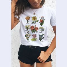 This super cool aesthetic flowers t shirt has a very soft, loose fit! So comfy and trendy for a casual look. Roll the sleeves up, tie on the side for a cropped look and style with high waist denim bottoms and combat boots or sneakers! ------------------------------------------------------------------------------------------------------------------------------------------------- * 100% ring-spun cotton * 4.5 oz/y² (153 g/m²) * Pre-shrunk * Shoulder-to-shoulder taping * Quarter-turned to avoid cre Flower Chart, T Shirt Aesthetic, Cottagecore Shirt, T Shirt Flowers, Shirt Aesthetic, Aesthetic T Shirts, Hand Drawn Flowers, Bottoming Shirt, Flower Shirt