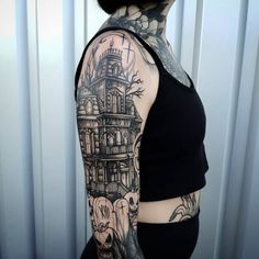 a woman with a tattoo on her arm