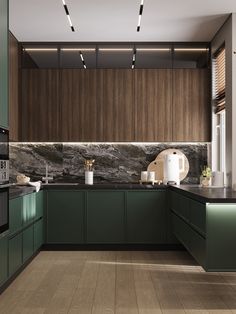 a modern kitchen with green cabinets and marble counter tops, along with wood flooring