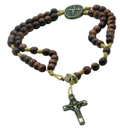 Beautiful and authentic wood religious gifts and jewelry Gorgeous and unique line of Saint Benedict jewelry and gifts Rosarios Catolicos handmade in Brazill Rosary turns into a religious bracelet Excellent Favors for Special Events – Christmas, Mother's Day, First Communion, Weddings and more! Saint Benedict Medal Cherry Wooden Beads Rosary Bracelet Features: • Solid, Jatoba wood mini rosary beads bracelet with St. Benedict crucifix and medallion junction. St. Benedict Medal embedded on both sid Catholic Rosary Bracelet, Saint Benedict Medal, Mini Rosaries, St Benedict Medal, Benedict Medal, Bracelet Pack, Prayers For Strength, St Benedict, Saint Benedict