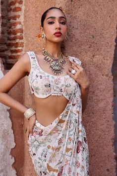 Ivory pre-draped saree with floral print. Paired with a floral print padded blouse with an asymmetric hem with beaded tassel drops. - Aza Fashions Draped Saree, Padded Blouse, Drape Saree, Saree With Blouse, Printed Sarees, Asymmetric Hem, Aza Fashion, Flower Prints, Blouses For Women