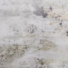 an old dirty wall with some stains and dirt on the surface, as well as paint