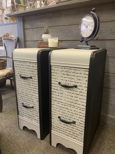 two black and white filing cabinets sitting next to each other