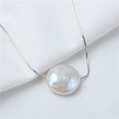 "12-15mm Large Coin Pearl Pendant for sale! It's single floating pearl pendant. Very good daily ornament for Summer! Pearl Type: Chinese Cultured Freshwater Pearl Pearl Size:12-15mm Pearl Shape: Coin Pearl Grade:AAA Pearl Color: Natural White Findings:925 silver Chain Type: 925 silver Box Chain Length:18\" 1.Here is the link of matching COIN PEARL Earrings : https://www.etsy.com/listing/453226164/12-15mm-big-coin-pearl-earringsirregular?ref=shop_home_active_1 2.Here is the link of coin pearl bea White Gold Pearl Necklace With Round Beads Pendant, Pearl Drop Round Necklace, Pearl Drop Necklace With Round Pearls, Pearl Necklace With Pendant For Anniversary, White Round Necklaces For Mother's Day, Baroque Pearl Necklace With Round Pendant, Classic Pearl White Necklace For Mother's Day, Mother's Day Pearl White Round Necklaces, Pearl White Round Pearl Necklace For Gift