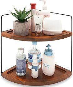 two tiered wooden shelf with bottles and soaps