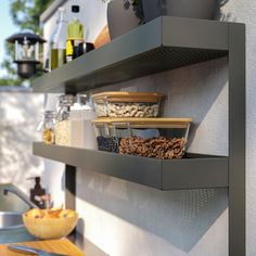 the shelves are filled with various foods and condiments to eat in the kitchen