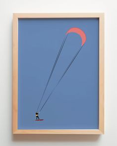 a man is parasailing in the blue sky with a red kite behind him