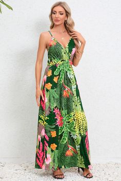 This printed surplice maxi cami dress is perfect for the modern woman's laid-back lifestyle. With its casual yet chic design, this dress is the perfect addition to any wardrobe. The maxi length elongates the silhouette while the surplice neckline adds a touch of elegance. A must-have for any fashion-forward individual. Features: Basic style Sheer: Opaque Stretch: No stretch Body: Not lined Material composition: 95% polyester, 5% spandex Care instructions: Machine wash cold. Tumble dry low. Impor Spring Tropical Print V-neck Maxi Dress, Summer V-neck Printed Maxi Dress, Tropical V-neck Sundress For Spring, Printed V-neck Rayon Maxi Dress, Spring Printed Maxi Dress With Spaghetti Straps, Printed Maxi Dress With Spaghetti Straps For Spring, Casual Printed V-neck Maxi Dress, Summer Sundress With Surplice Neckline, Flowy Maxi Dress With Surplice Neckline For Vacation