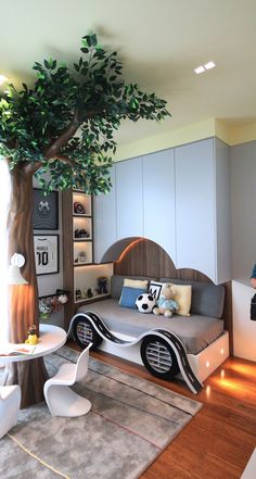 a living room with a tree in the corner