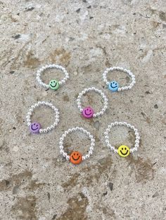 ☺ The smiley ring ☺ There is always a reason to smile ☺ The perfect gift for yourself or a loved one as a reminder to smile everyday. ☺ Made with 7mm acrylic smiley faces - choose your colour before adding to cart ☺ 3mm silver plated beads - choose your finish before adding to cart  ☺ Clear strong stretch magic cord ☺ Size ranges are US ring sizes - choose before adding to cart **Orders will be shipped to the address you have on file with Etsy/PayPal. Please check it prior to submitting an order Playful Silver Jewelry For Friendship, Fun Silver Jewelry For Friendship, Sterling Silver Friendship Ring, Friendship Sterling Silver Ring, Fun Silver Jewelry For Birthday, Smiley Face Round Jewelry For Friendship, Round Smiley Face Jewelry For Friendship, Fun Sterling Silver Jewelry In Silver, Fun Sterling Silver Jewelry In Silver Color