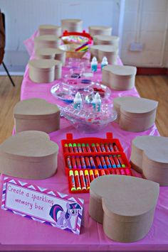 the table is set up with many items for children's birthdays and parties