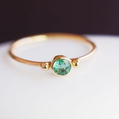 "This beautiful dainty Colombian Emerald ring is perfect for small engagement fingers or stacking rings. The emerald has excellent clarity and a gorgeous green colour typical of a Colombian Emerald. This is probably my favourite green colour in natural stones. An ideal solitaire, perfect for everyday use! Handcrafted in 18k solid gold featuring responsibly sourced gemstones. 18k gold will not oxidise or discolour. All natural emeralds have inclusions that add distinct character--so, no two gems are alike. All my gemstones are genuine mineral stones that are highly valued for their beauty, longevity and rarity. We use an array of high quality, natural gemstones. The power of Emerald The gorgeous Emerald stones were known as the \"Jewel of Kings\" and a symbolism of royalty and the sacred st Engagement Finger, Tanzanite Studs, Colombian Emerald Ring, Sacred Stones, Colombian Emeralds, Mineral Stone, Emerald Stone, Emerald Gemstone, Green Colour