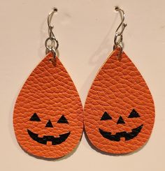 Dangle orange pumpkin teardrop shaped earring.  Made of leather. Casual Orange Earrings, Pumpkin Earring Svg, Handmade Orange Teardrop Earrings, Adjustable Orange Teardrop Earrings, Pumpkin Faux Leather Earrings, Fun Orange Earrings For Halloween, Orange Dangle Earrings For Halloween, Handmade Teardrop Faux Leather Earrings, Pumpkin Earrings