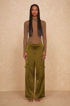 Elegant yet bold, the Giselle Bodysuit is your new go-to for a statement look. Crafted from soft olive mesh, this high-neck design offers a sleek silhouette that perfectly balances allure with sophistication. Model is 5'9 and wearing size Small Fall Staples, High Neck Designs, Cargo Pant, Sports Accessories, Satin Fabric, Neck Designs, Best Sellers, Jumpsuit Dress, Milan