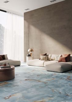 a living room filled with lots of furniture and walls covered in marbled tiles on the floor