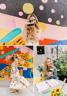 a woman holding up a camera and taking pictures in front of a wall with sunflowers