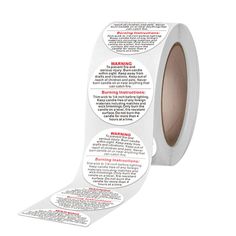 a roll of white tape with warning labels on it