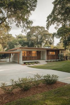 a modern house in the middle of a park