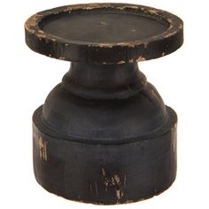 an old black candle holder on a white background